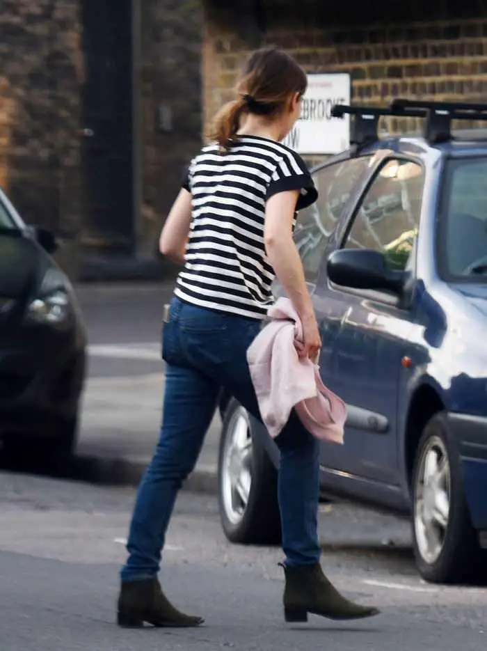 Emilia Clarke Cuts a Casual Figure in Black and White Striped T-Shirt