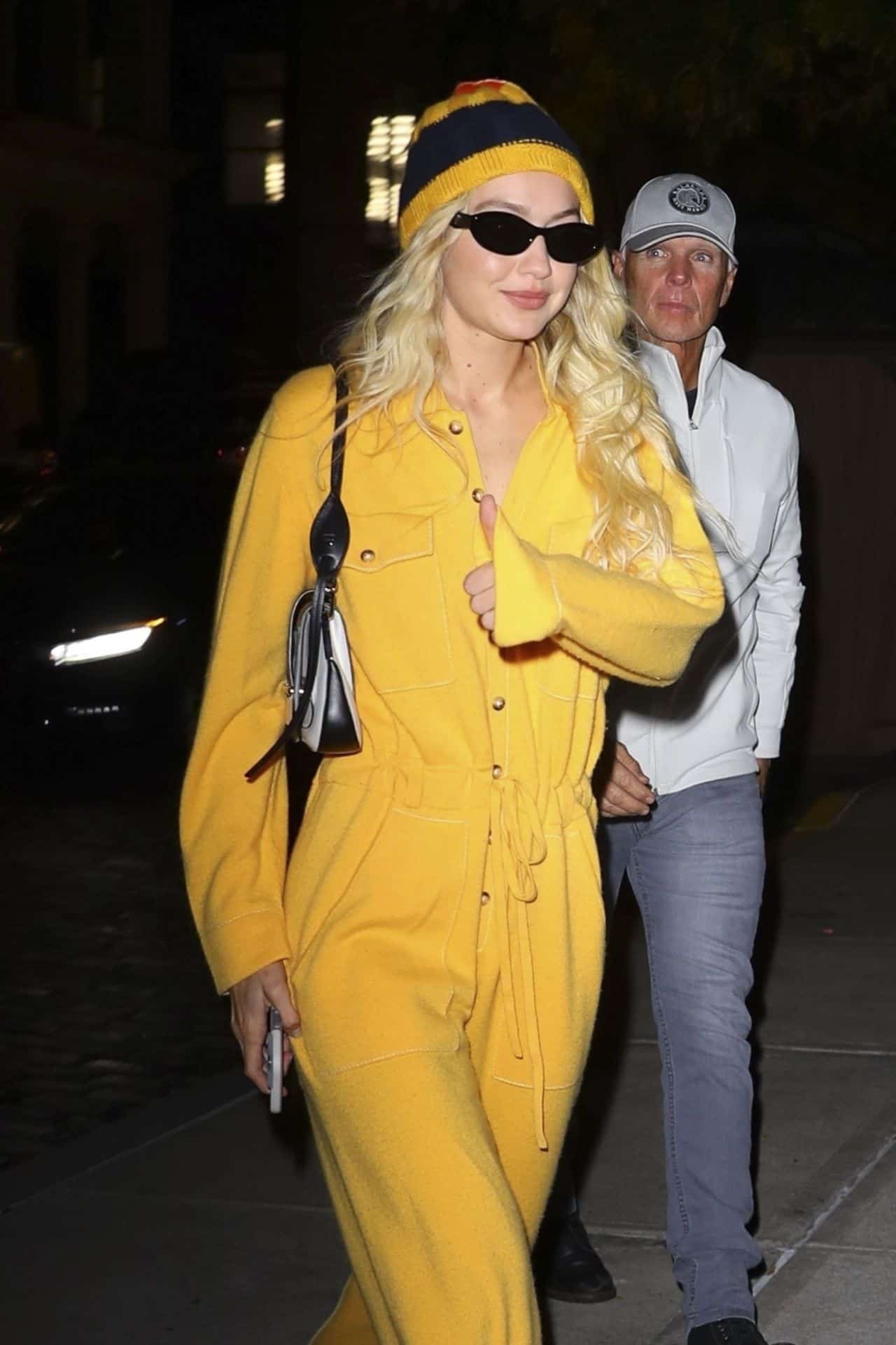 Gigi Hadid Embodies NYC Glamour in Yellow Jumpsuit and Matching Beanie