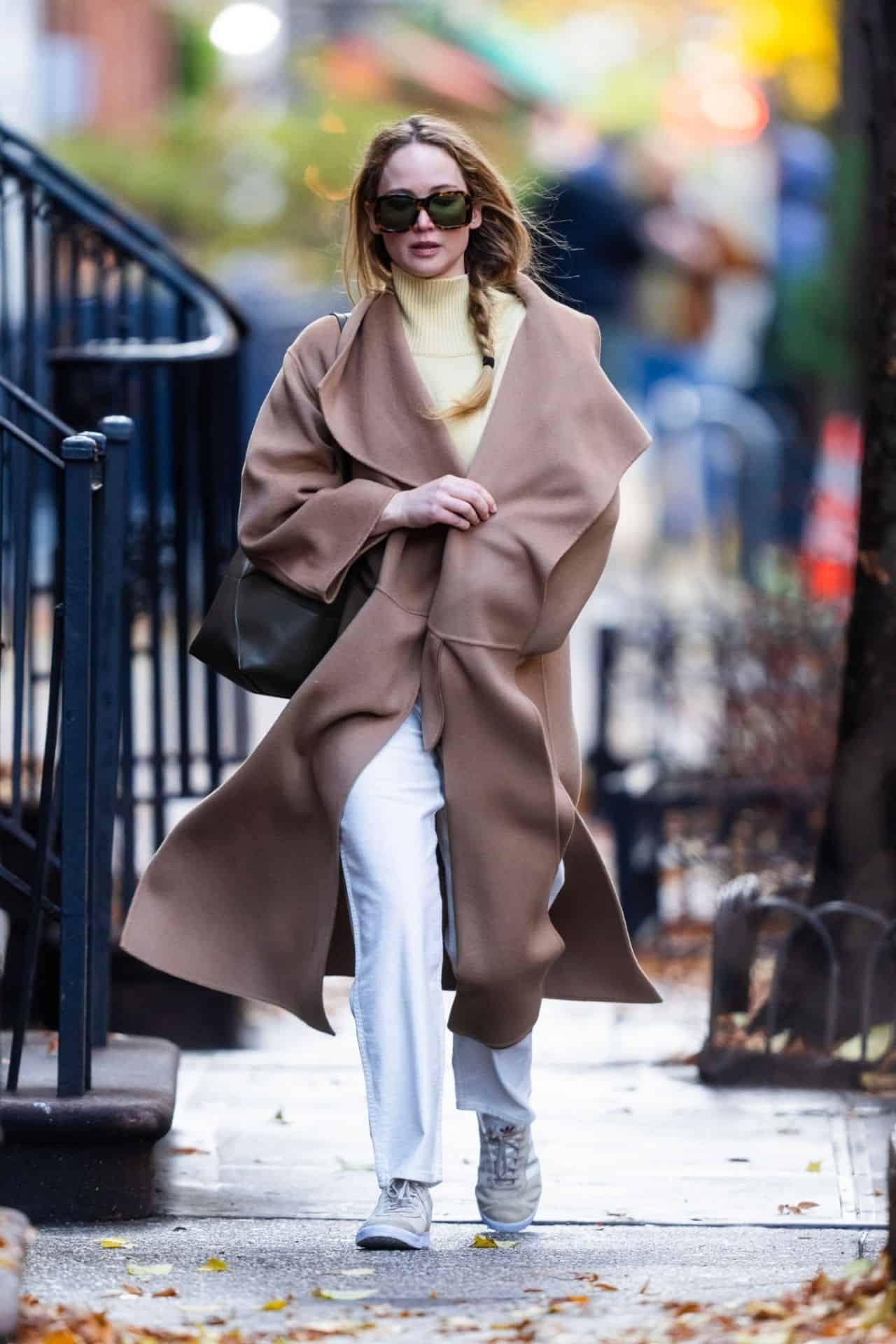 Jennifer Lawrence Radiates New York Chic in Beige Coat and White Pants