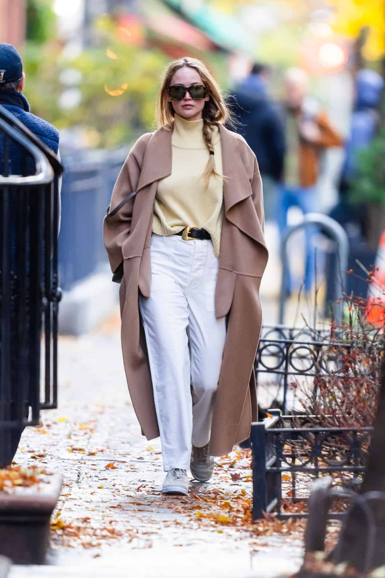 Jennifer Lawrence Radiates New York Chic in Beige Coat and White Pants