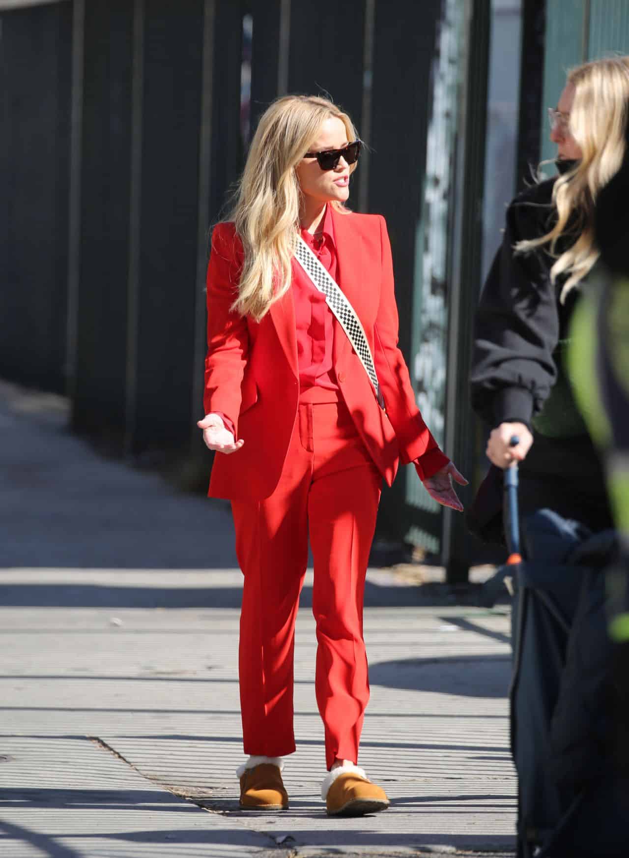 Reese Witherspoon Dazzles in Tailored Red Suit and Chic Cross-Body Bag