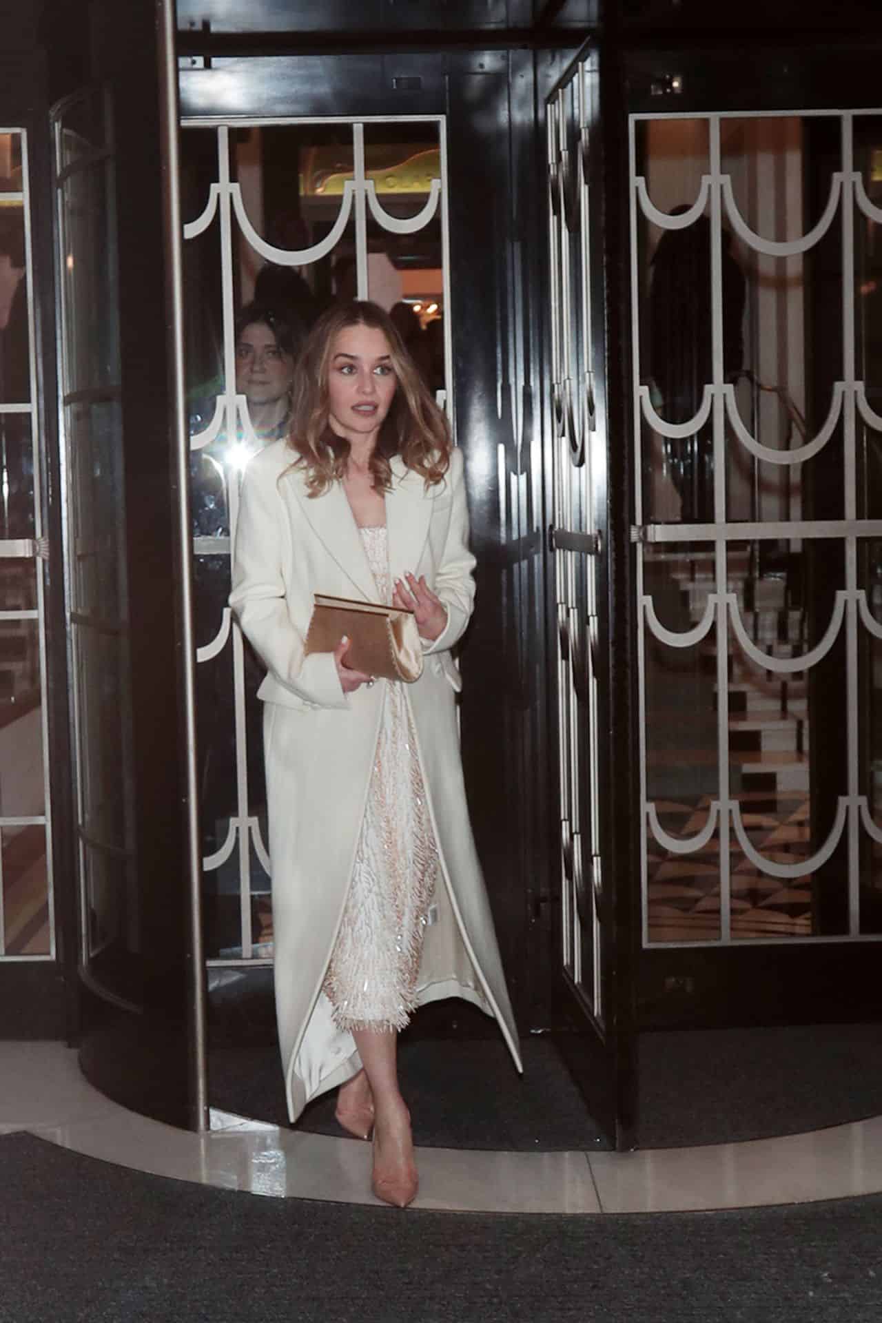 Emilia Clarke Radiates Elegance in Flowing Coat and Dazzling Dress