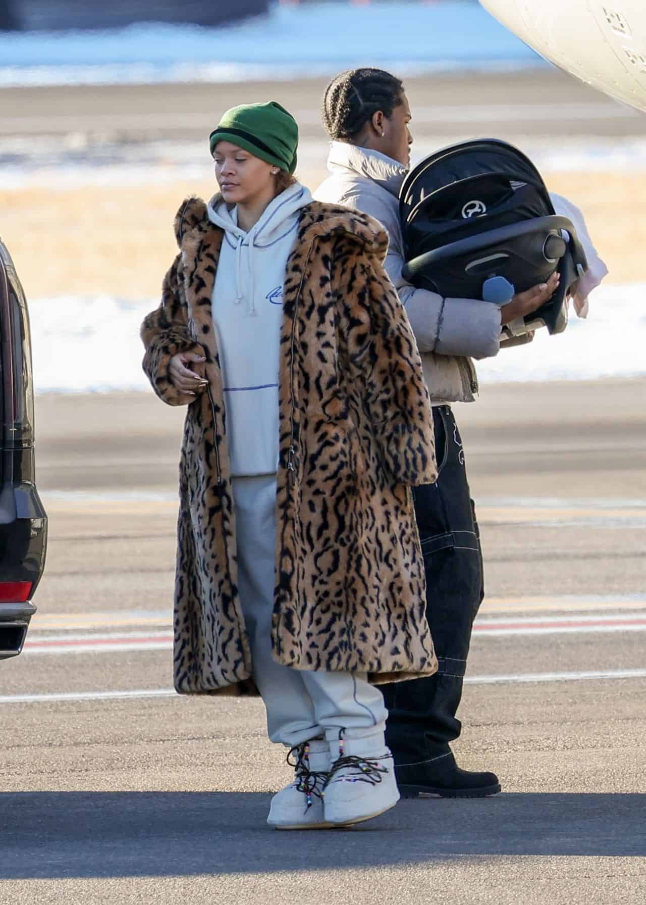Rihanna Dazzles in Leopard Print Coat and Chic White Ensemble at Aspen Airport