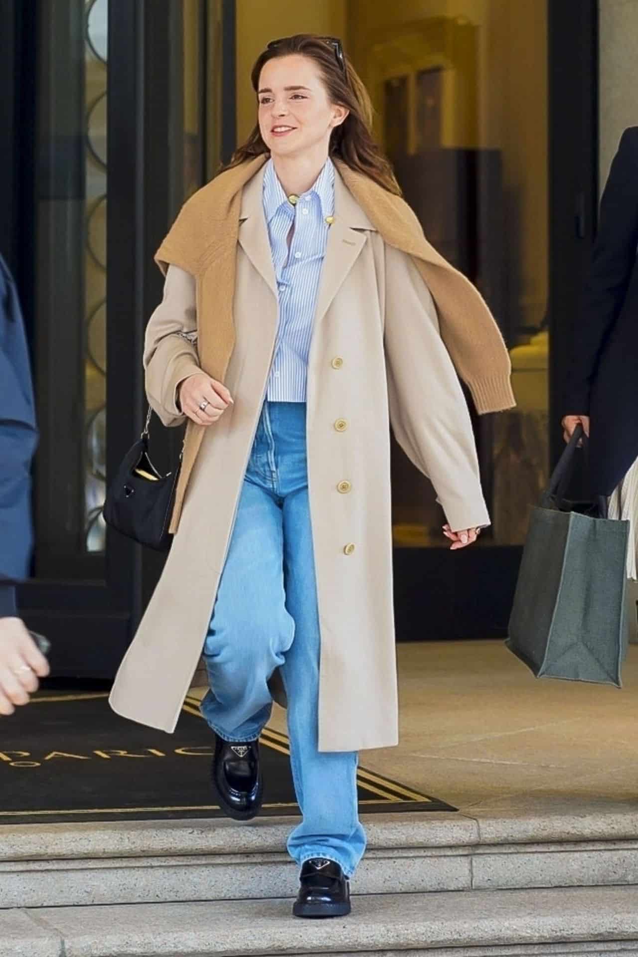 emma watson radiates casual elegance in trench coat and striped shirt 5