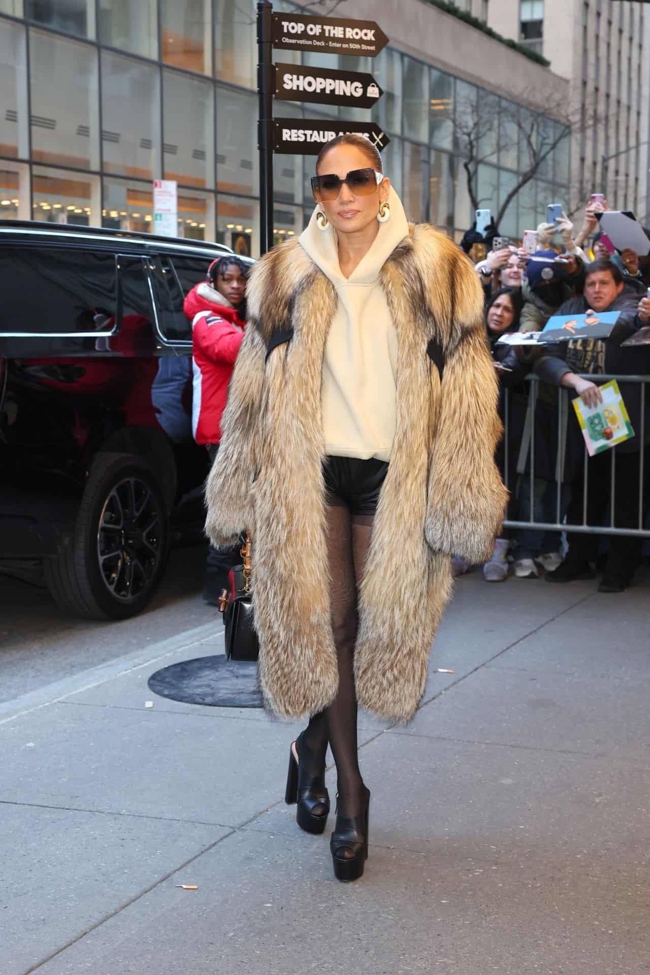 jennifer lopez radiates sophistication in fur coat and black shorts 9