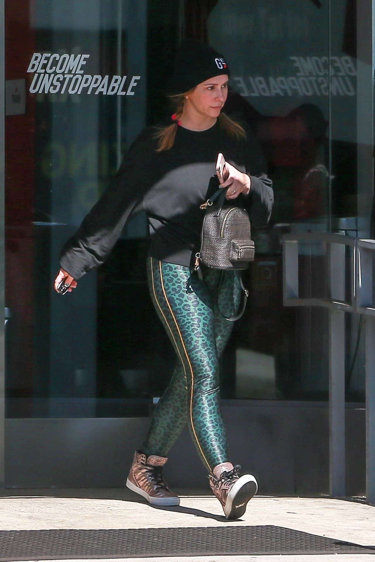 Jennifer Love Hewitt Flaunts Casual Elegance in Black Sweater and Leopard Leggings