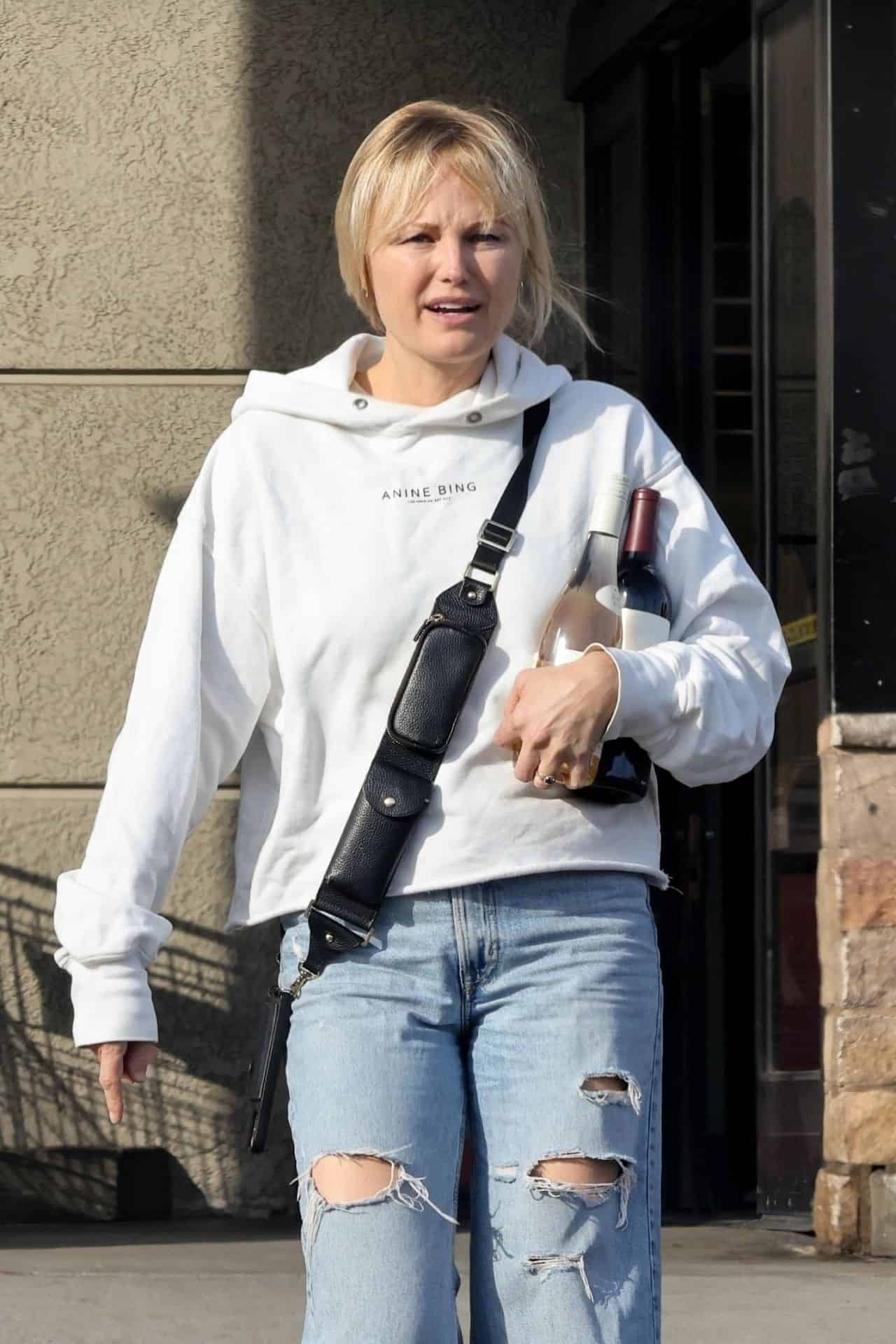 Malin Akerman Masters Casual Chic in Oversized Hoodie and Ripped Jeans