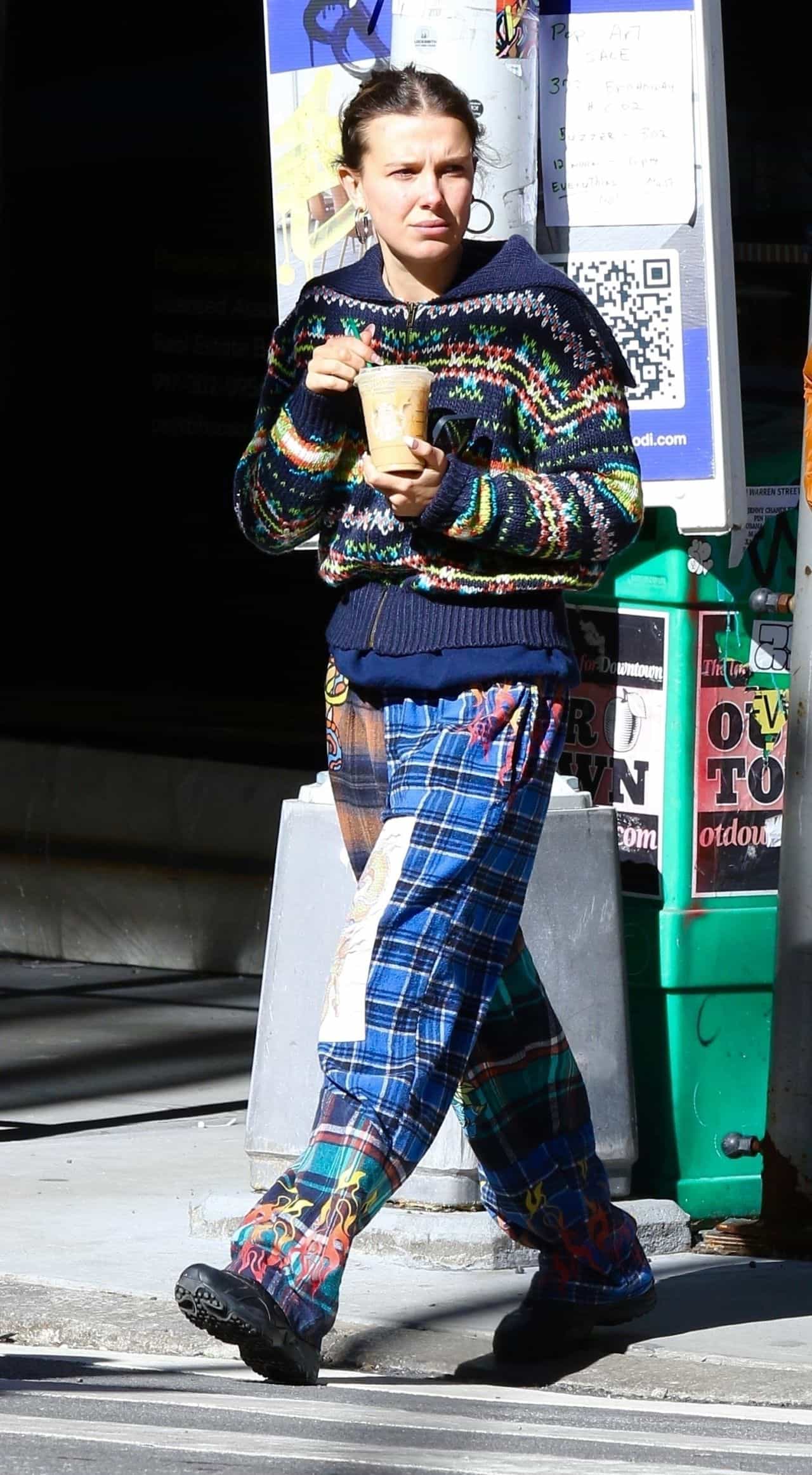 Millie Bobby Brown Radiates Casual Chic in Colorful Sweater and Plaid Pants