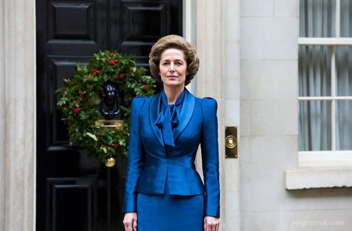 Fashion illustration of Gillian Anderson as Margaret Thatcher in The Crown, wearing a structured blue suit