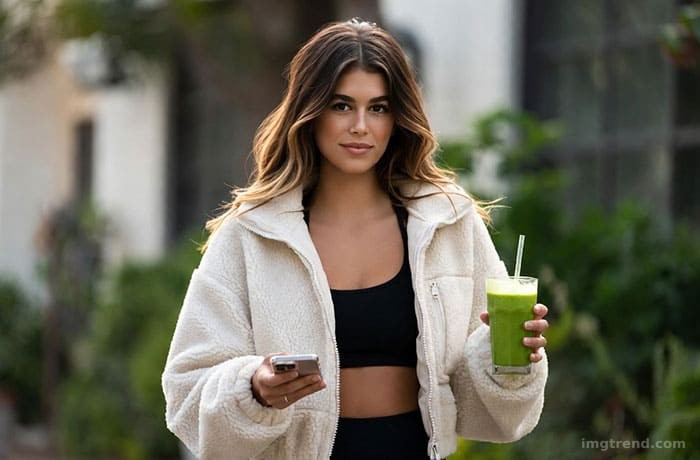 Editorial illustration of Kaia Gerber wearing an oversized fleece jacket and beanie post-workout