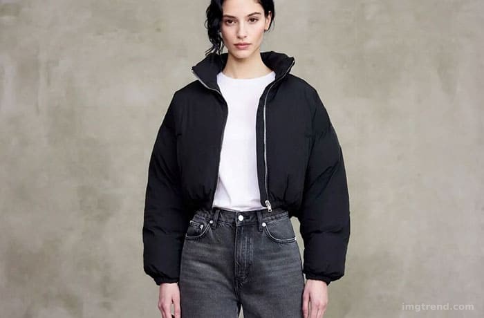 Fashion sketch of Kendall Jenner in a black puffer jacket and jeans, wearing dark sunglasses and holding a coffee
