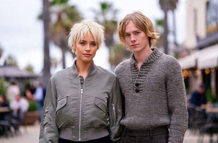 Fashion sketch of Kristen Stewart and Dylan Meyer walking in LA, wearing coordinated grunge-inspired outfits
