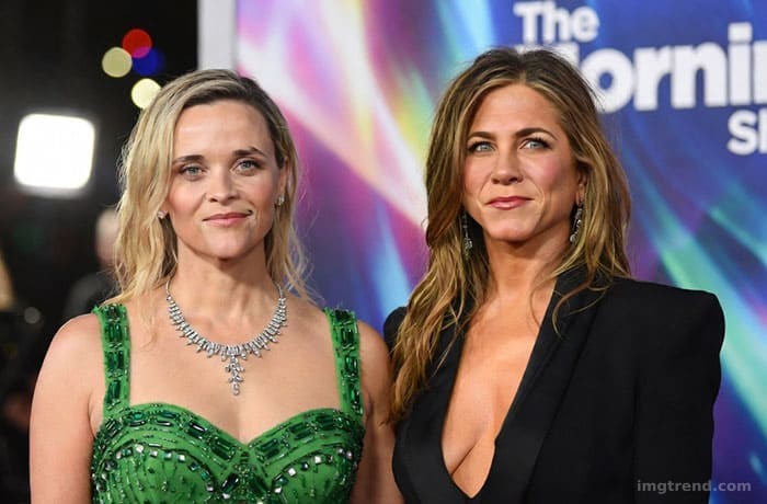 Editorial sketch of Reese Witherspoon and Jennifer Aniston posing together at a premiere, contrasting styles